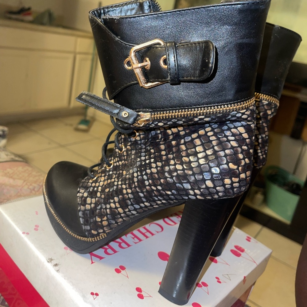 Snake skin heeled boots